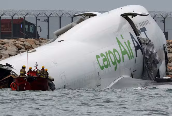 Cargo aircraft skids off Hong Kong runway, killing two